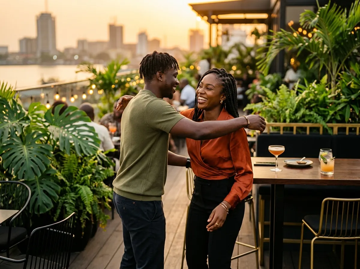 Two people greeting each other at a rooftop bar at sunset in Lagos